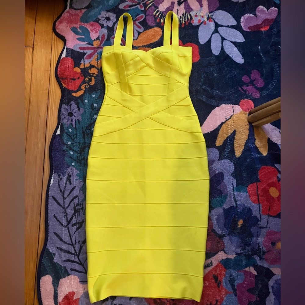 Yellow cocktail dress with small imperfections.